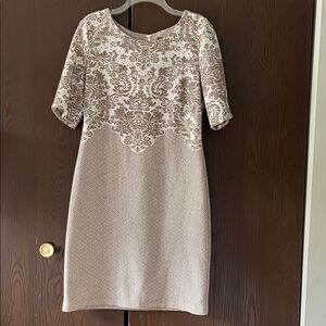 Connected short sleeved cream and tan midi dress. Size 12.